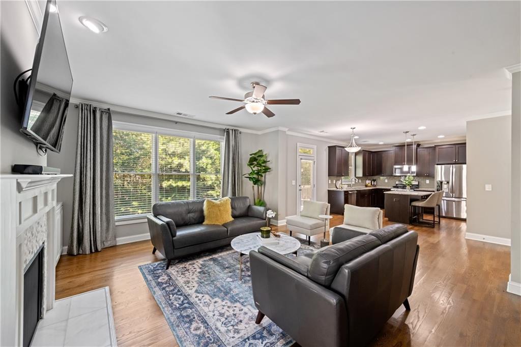 2199 Collins Ridge Drive Northwest Atlanta, GA 30318 - Photo 12 of 50 a living room with furniture fireplace and a large window