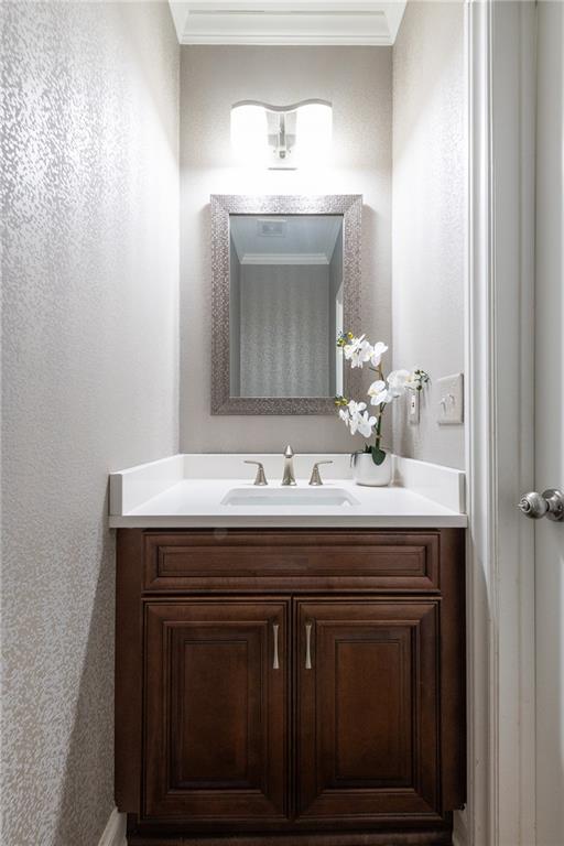 2199 Collins Ridge Drive Northwest Atlanta, GA 30318 - Photo 15 of 50 a bathroom with a sink and a mirror