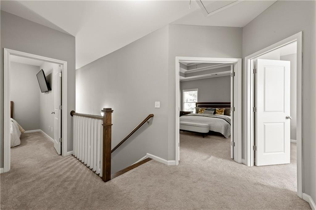 2199 Collins Ridge Drive Northwest Atlanta, GA 30318 - Photo 16 of 50 a view of a bedroom with a bed and a lamp