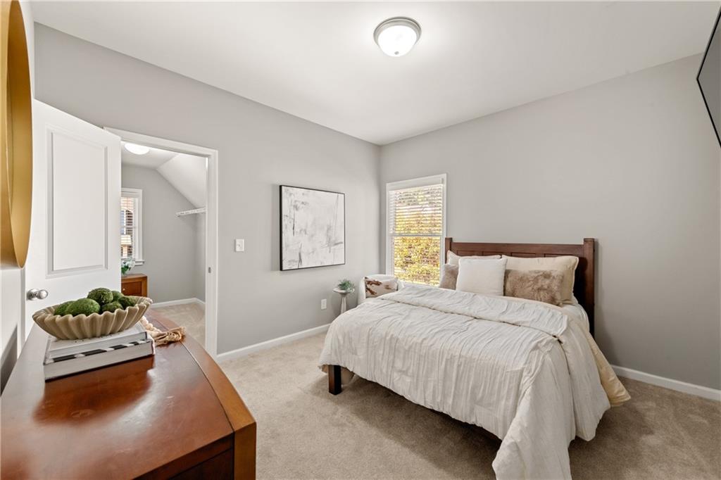 2199 Collins Ridge Drive Northwest Atlanta, GA 30318 - Photo 26 of 50 a bedroom with a bed and a couch