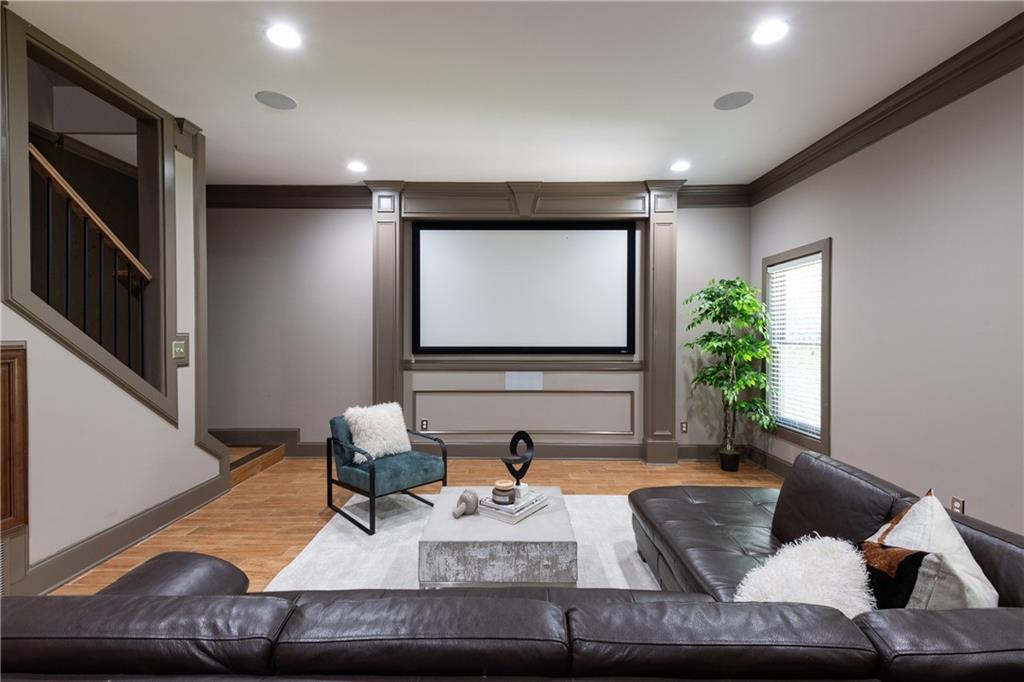 2199 Collins Ridge Drive Northwest Atlanta, GA 30318 - Photo 34 of 50 a living room with furniture and a flat screen tv