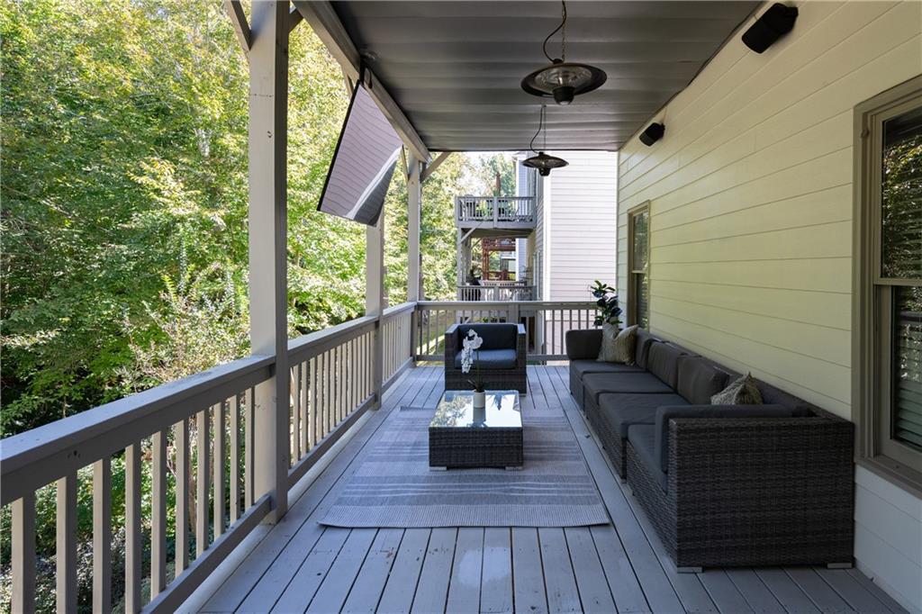 2199 Collins Ridge Drive Northwest Atlanta, GA 30318 - Photo 43 of 50 a view of balcony with couch and wooden floor