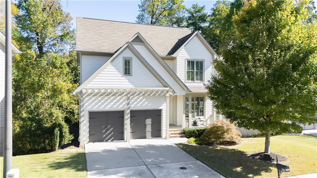2199 Collins Ridge Drive Northwest Atlanta, GA 30318 - Photo 48 of 50 a view of house with a yard and potted plants
