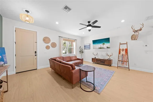 a living room with furniture and a window