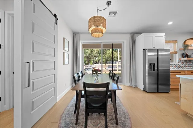 a dining room with furniture and window