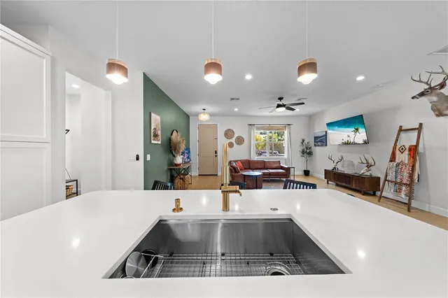 a view of living room with furniture and a large window