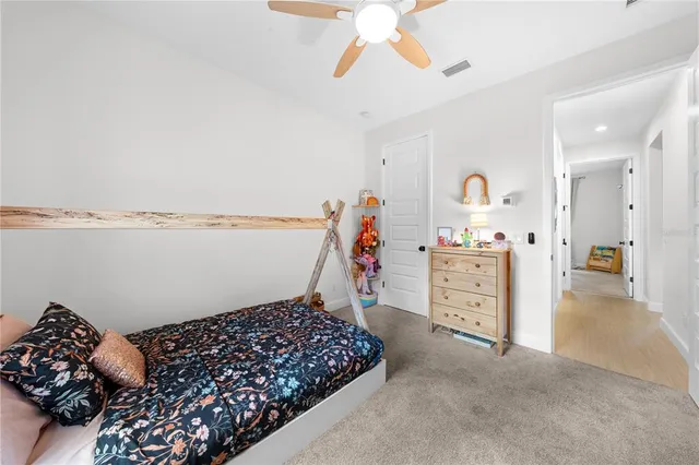 a bed room with a bed and a chandelier