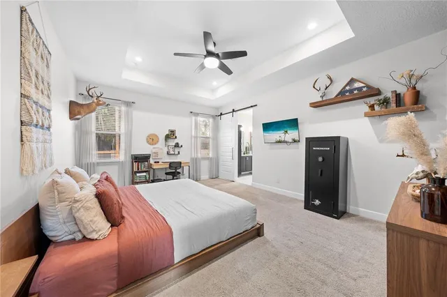 a bedroom with a bed furniture and a window