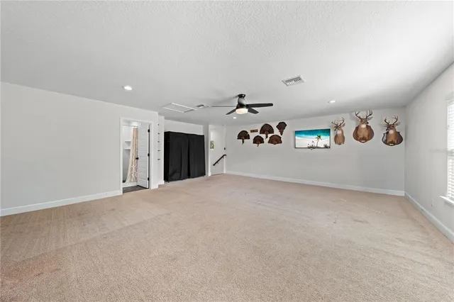 a view of a house with swimming pool and sitting area