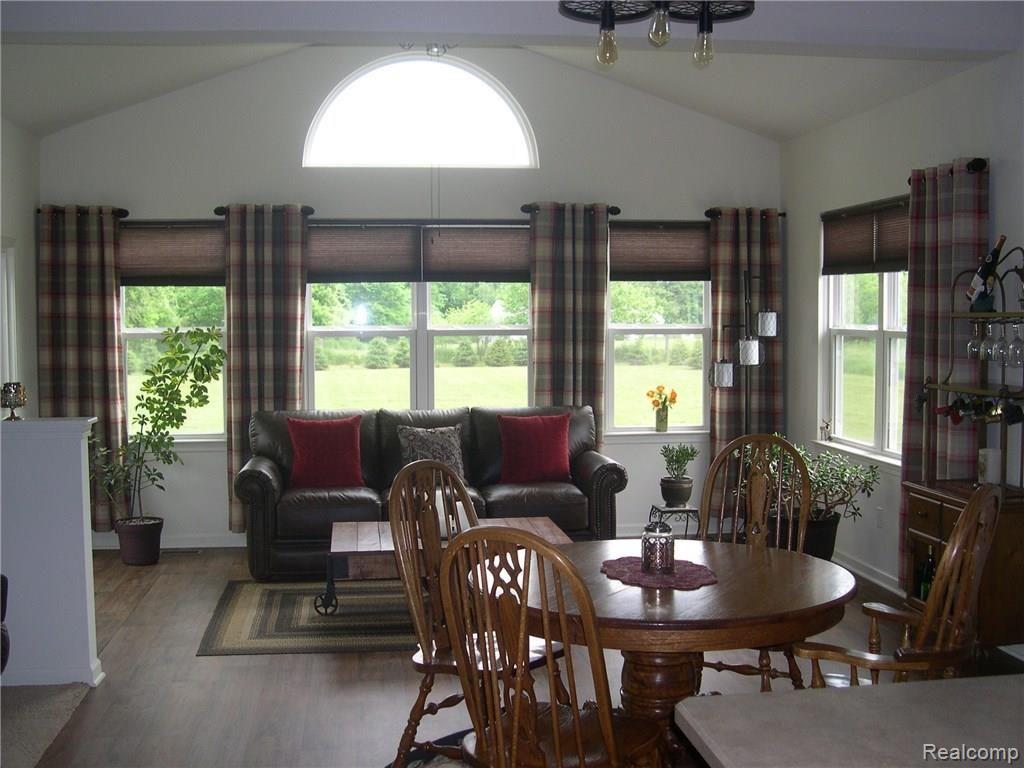 4170 Elevation Lane Howell, MI 48855 - Photo 11 of 36 SUN ROOM LISTED AS LIBRARY/STUDY ON MLS TICKET HAS LARGE WINDOWS INCLUDING 1/2 MOON AND DOOR WALL TO BACK YARD