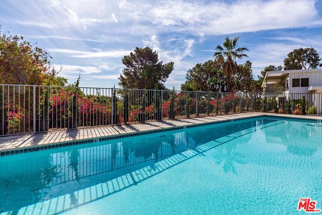 a view of a swimming pool with a garden
