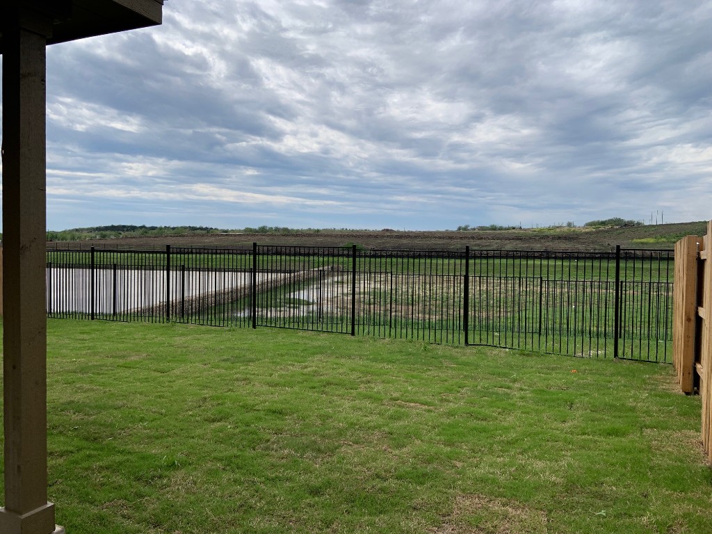 152 Lime Street Buda, TX 78610 - Photo 13 of 32 a view of a garden with a basketball court