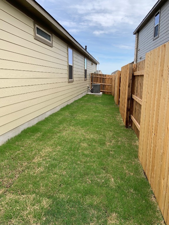 152 Lime Street Buda, TX 78610 - Photo 14 of 32 a backyard of a house