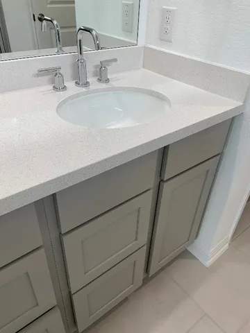 a bathroom with a sink and a mirror