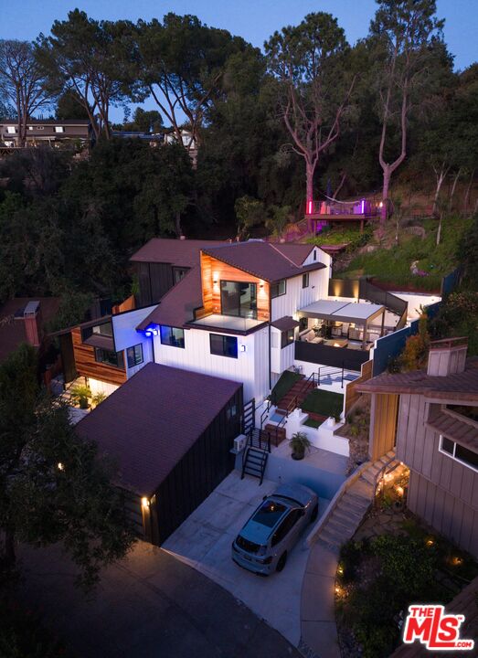 4118 Oak Hollow Road Calabasas, CA 91302 - Photo 51 of 55 a view of multiple houses with a patio