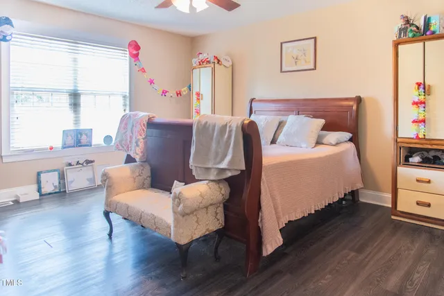 a bedroom with a bed and a dresser