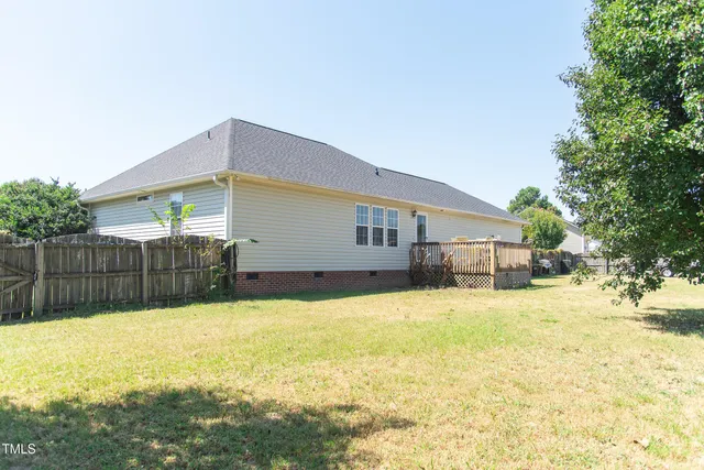 a view of a back yard of the house