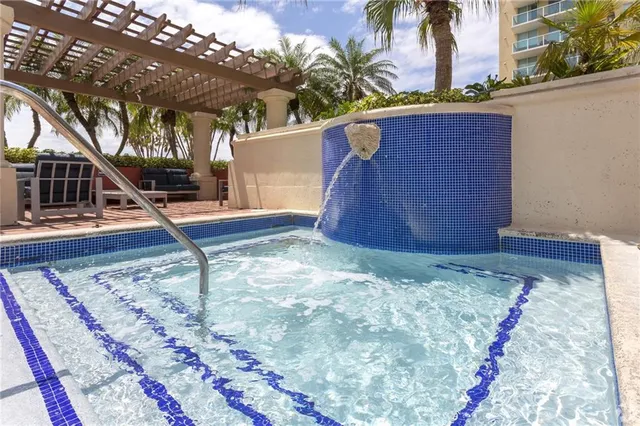 a living room with furniture and a baby crib