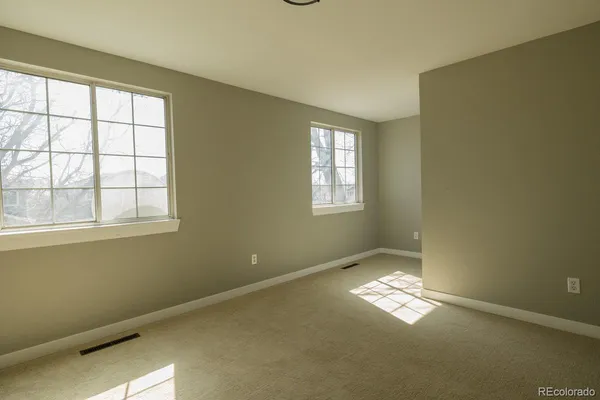 a view of an empty room with a window