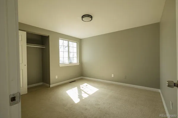 a bathroom with a toilet a sink and shower
