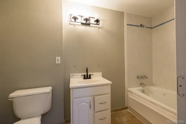 a bathroom with a sink and a bathtub