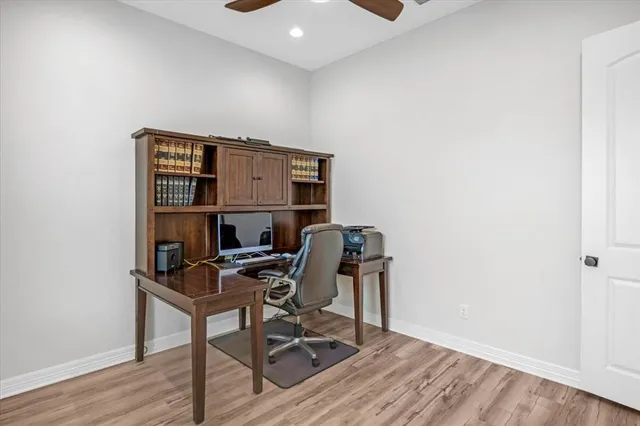 a workspace with furniture and wooden floor