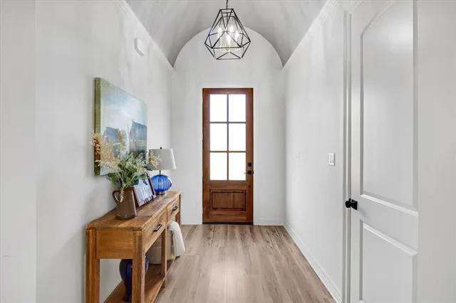 a view of an entryway with wooden floor