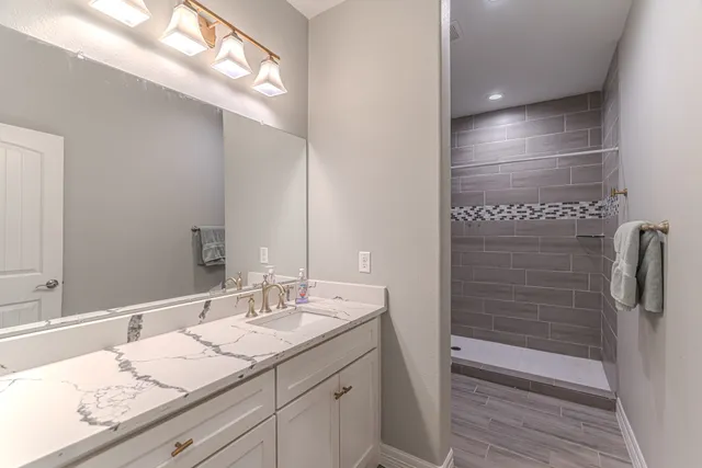 a bedroom with a bed and a lamp