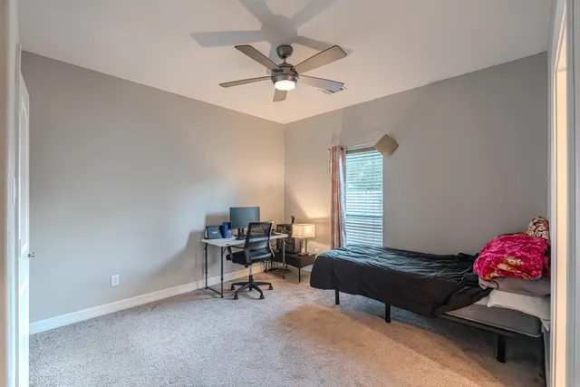 a bathroom with a sink a mirror and shower