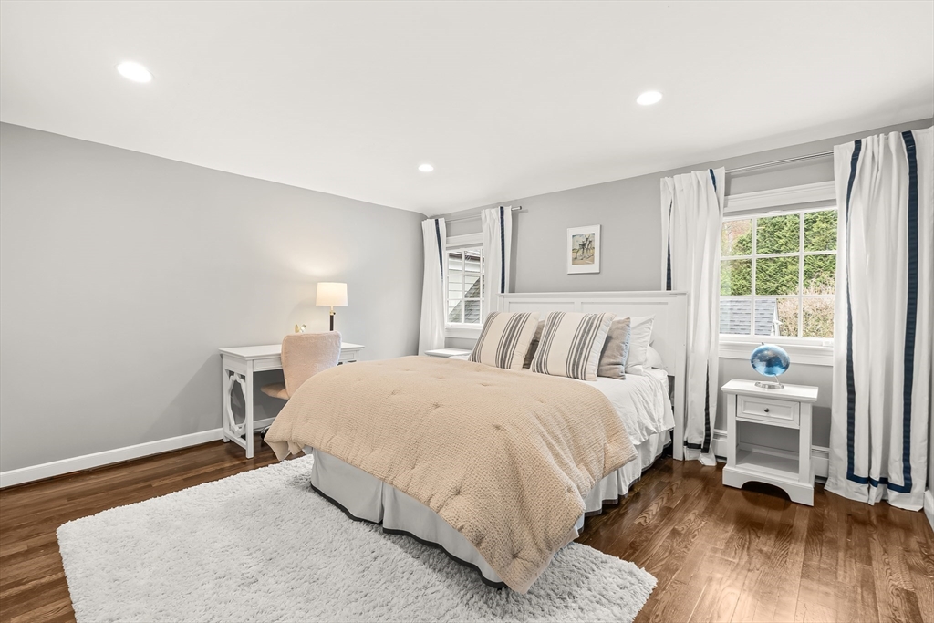 27 Radcliffe Road Wellesley, MA 02482 - Photo 22 of 38 a bedroom with a bed and wooden floor