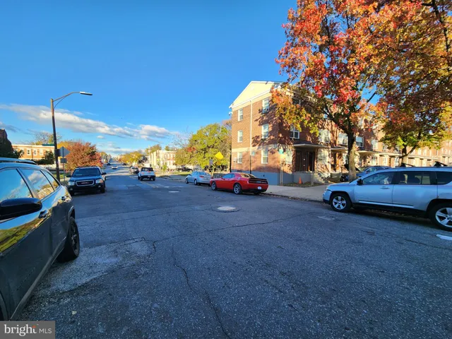 a view of car parked on the roadside