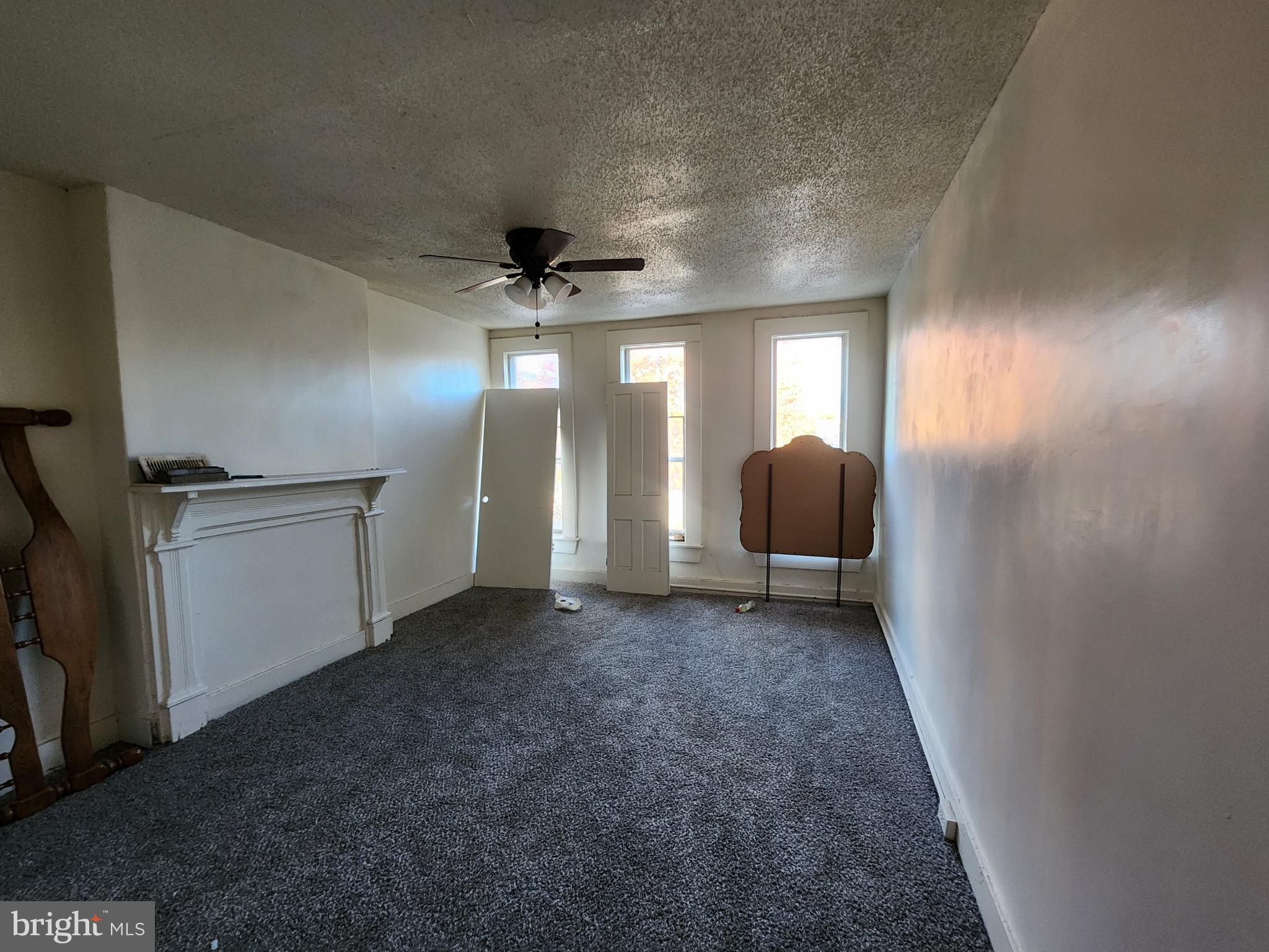 1719 Baker Street Baltimore, MD 21217 - Photo 8 of 16 a view of a livingroom with a staircase