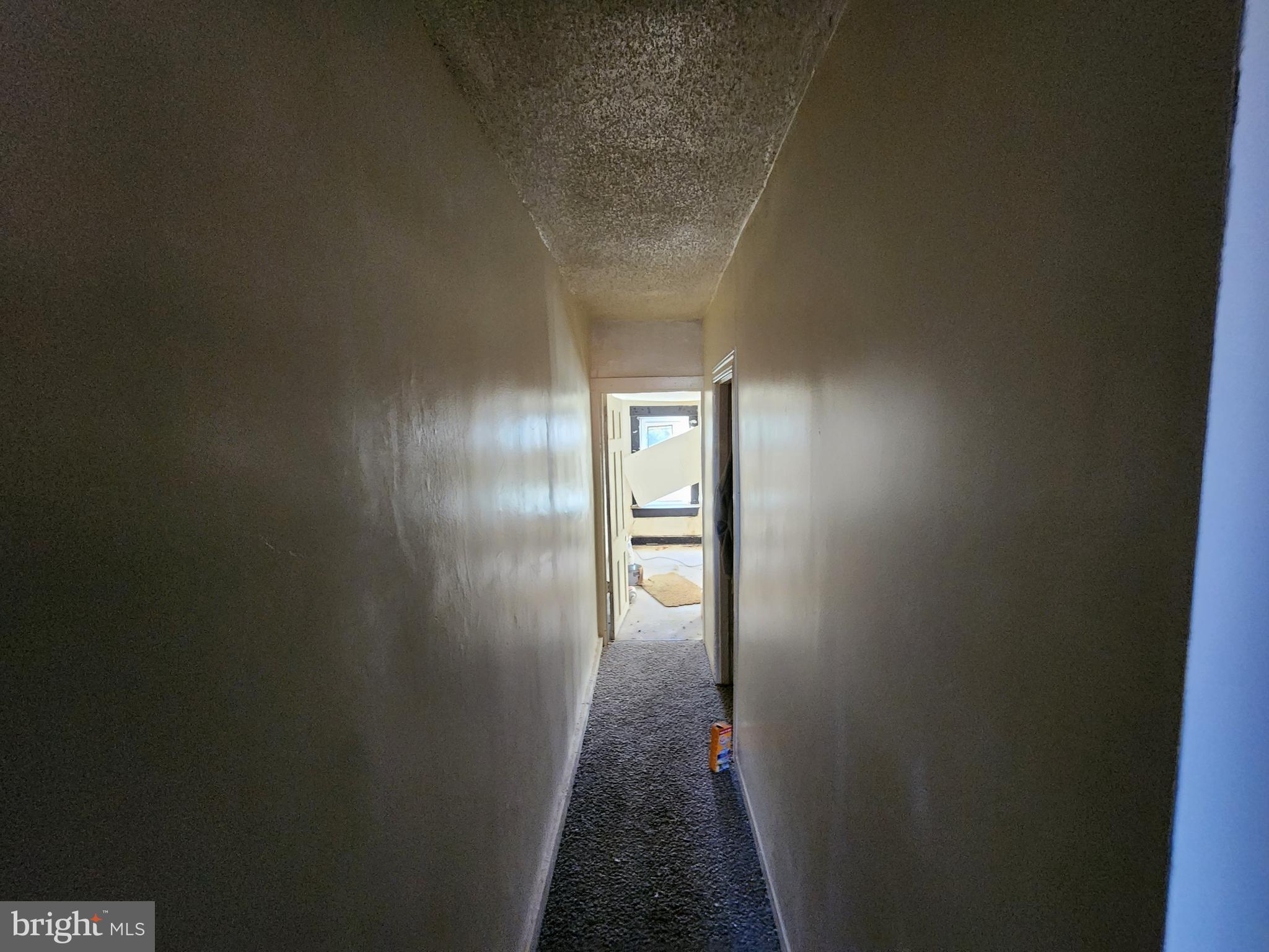 1719 Baker Street Baltimore, MD 21217 - Photo 10 of 16 a view of a hallway with wooden floor