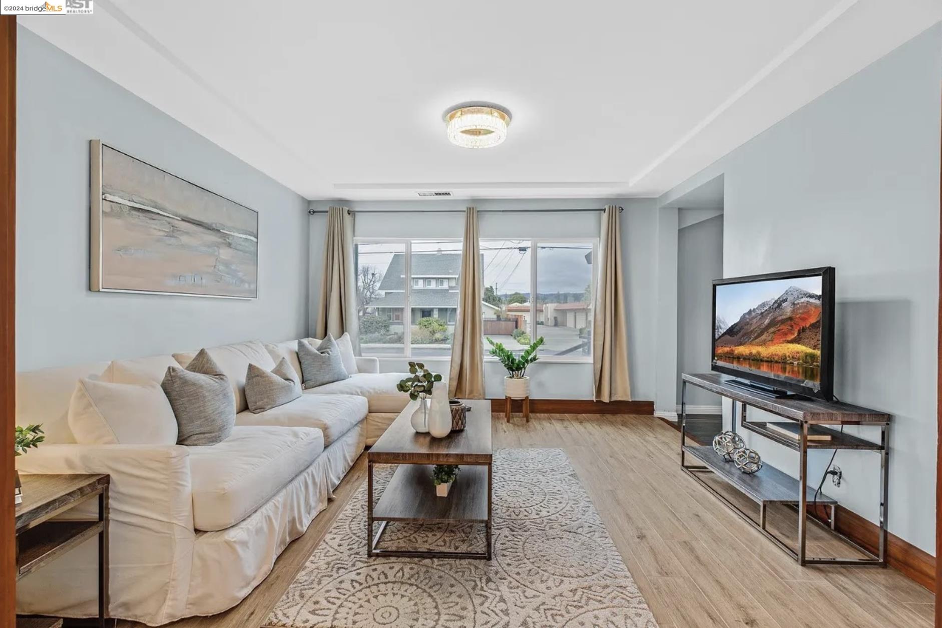 451 Sybil Avenue San Leandro, CA 94577 - Photo 11 of 28 a living room with furniture and a flat screen tv