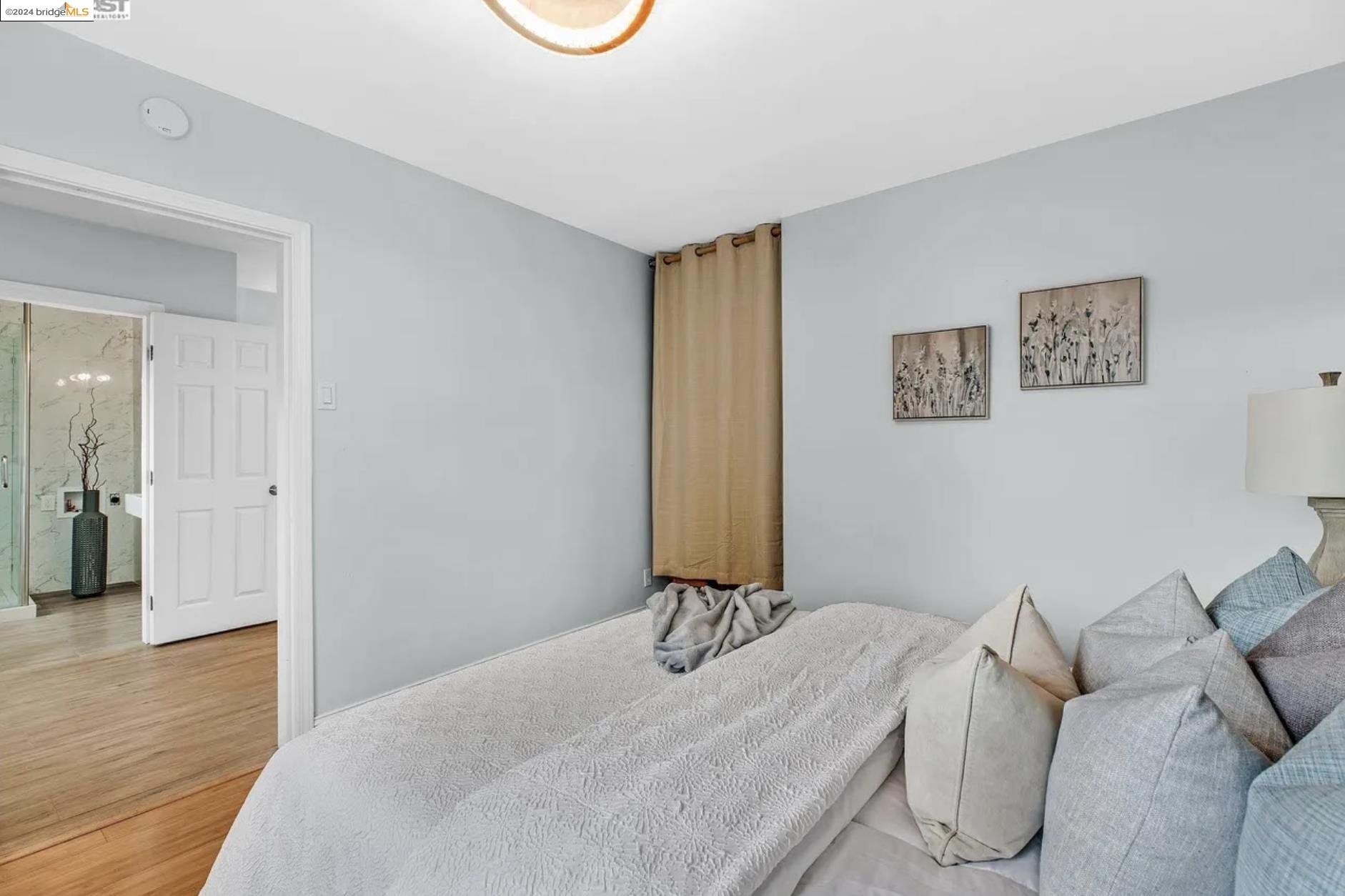 451 Sybil Avenue San Leandro, CA 94577 - Photo 18 of 28 a bedroom with a bed and a couch