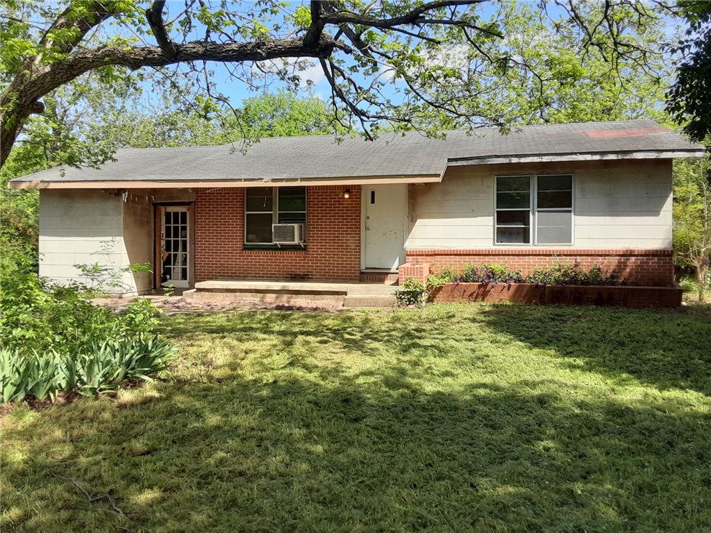 a house view with a garden space