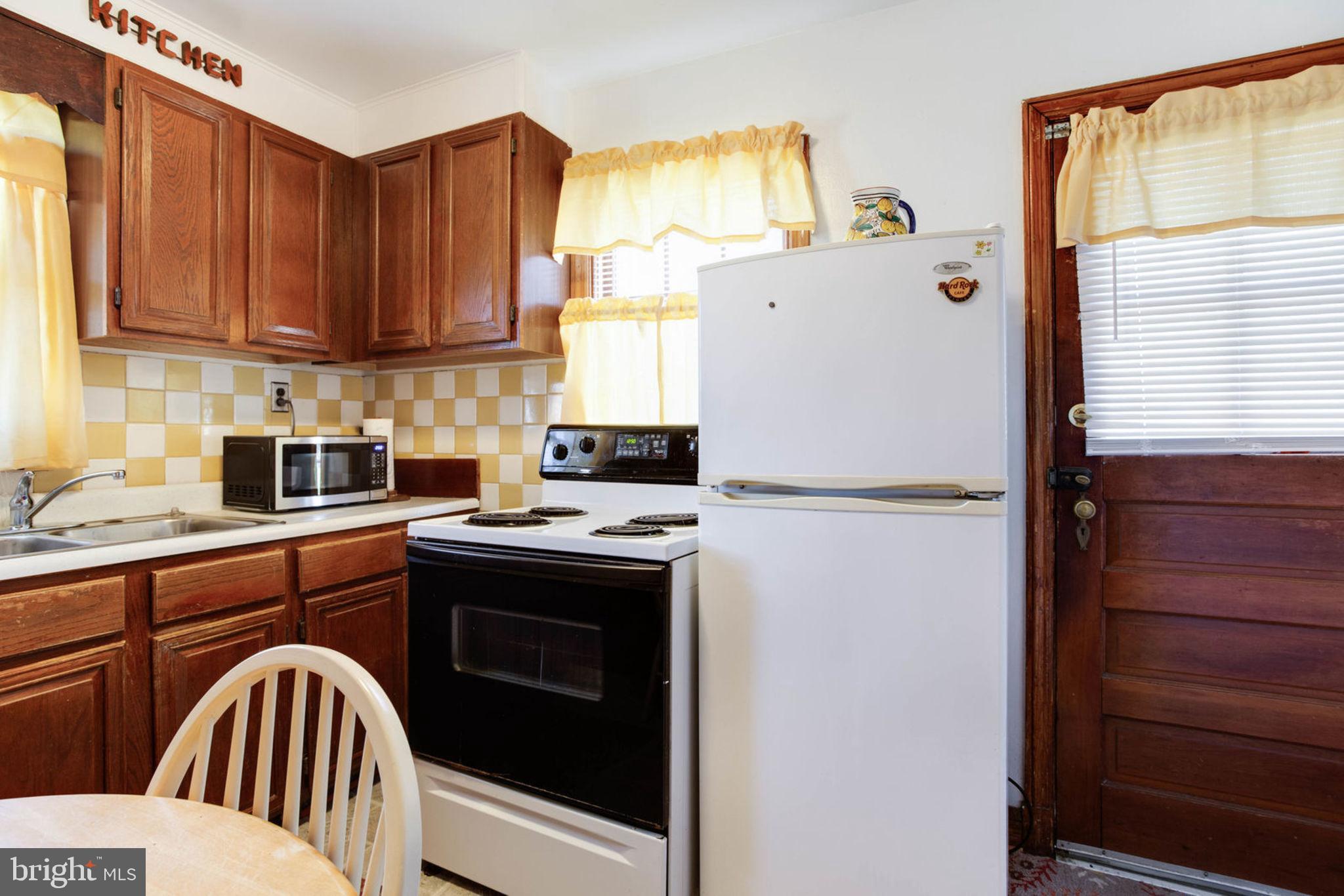 7841 Clark Station Road Severn, MD 21144 - Photo 12 of 46 Kitchen view with Rear Door Entrance