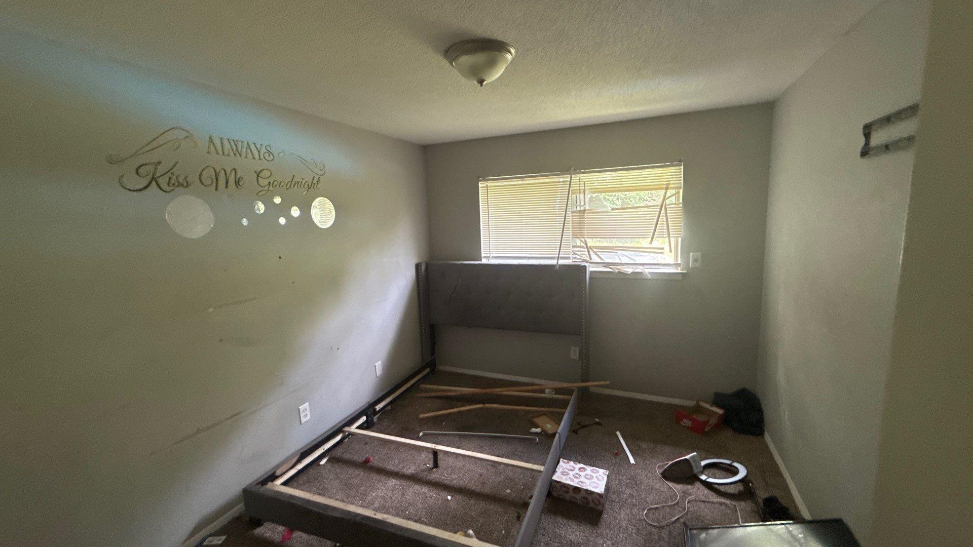 4939 Manson Road Memphis, TN 38109 - Photo 3 of 17 Interior room featuring a single window with blinds, carpeted flooring, and a ceiling-mounted light fixture