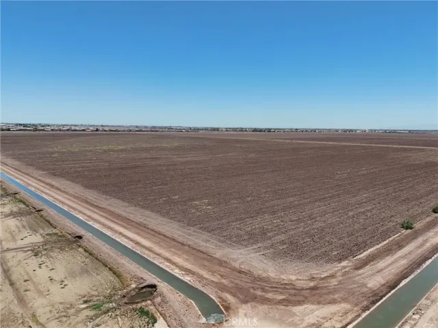 a view of an ocean beach and mountain