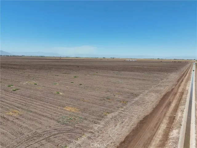 a view of an ocean beach and mountain