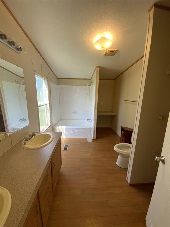 929 Neighbors Corner Road Mart, TX 76664 - Photo 14 of 28 a bathroom with a sink and a mirror