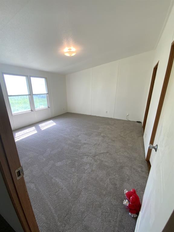 929 Neighbors Corner Road Mart, TX 76664 - Photo 17 of 28 en empty room with windows
