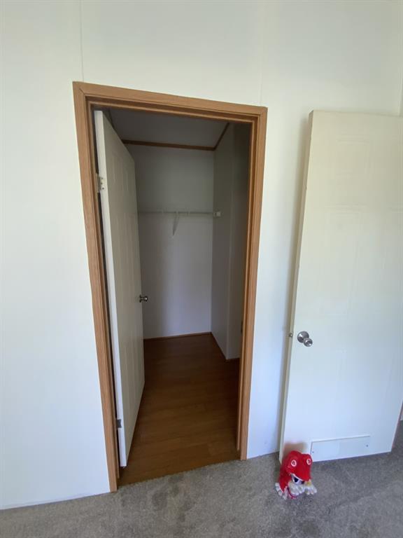 929 Neighbors Corner Road Mart, TX 76664 - Photo 18 of 28 an empty room with wooden floor and a window