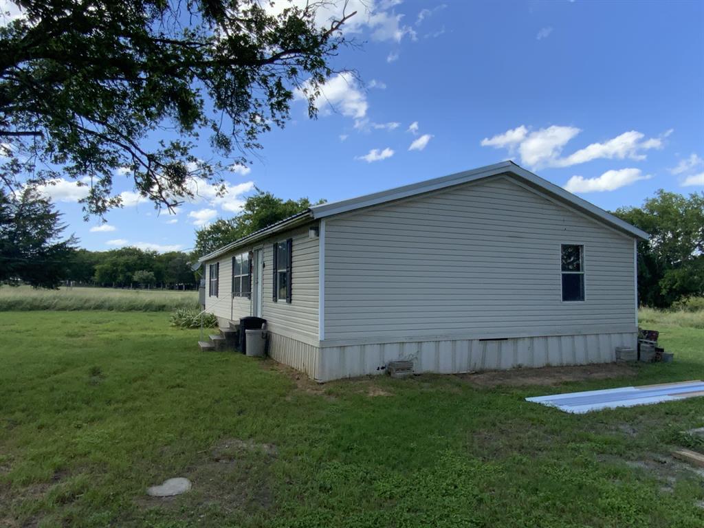929 Neighbors Corner Road Mart, TX 76664 - Photo 2 of 28 a backyard of a house with lots of green space