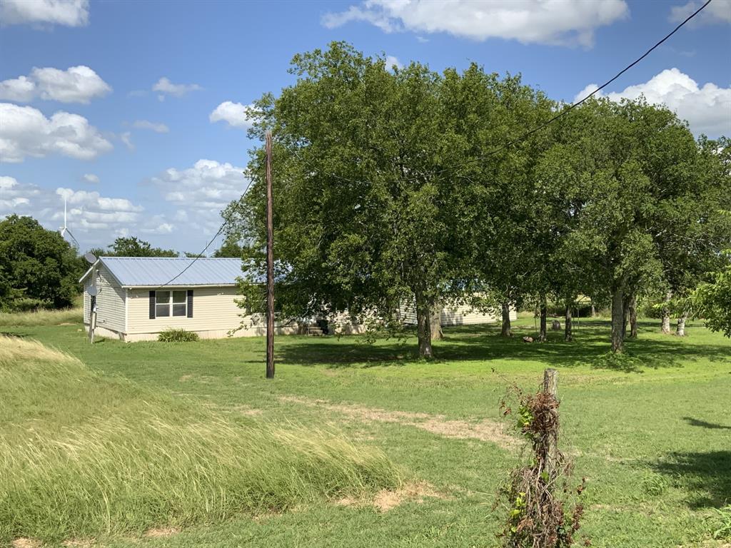929 Neighbors Corner Road Mart, TX 76664 - Photo 23 of 28 a front view of a house with a yard