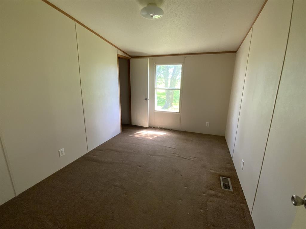929 Neighbors Corner Road Mart, TX 76664 - Photo 26 of 28 a view of an empty room with a window