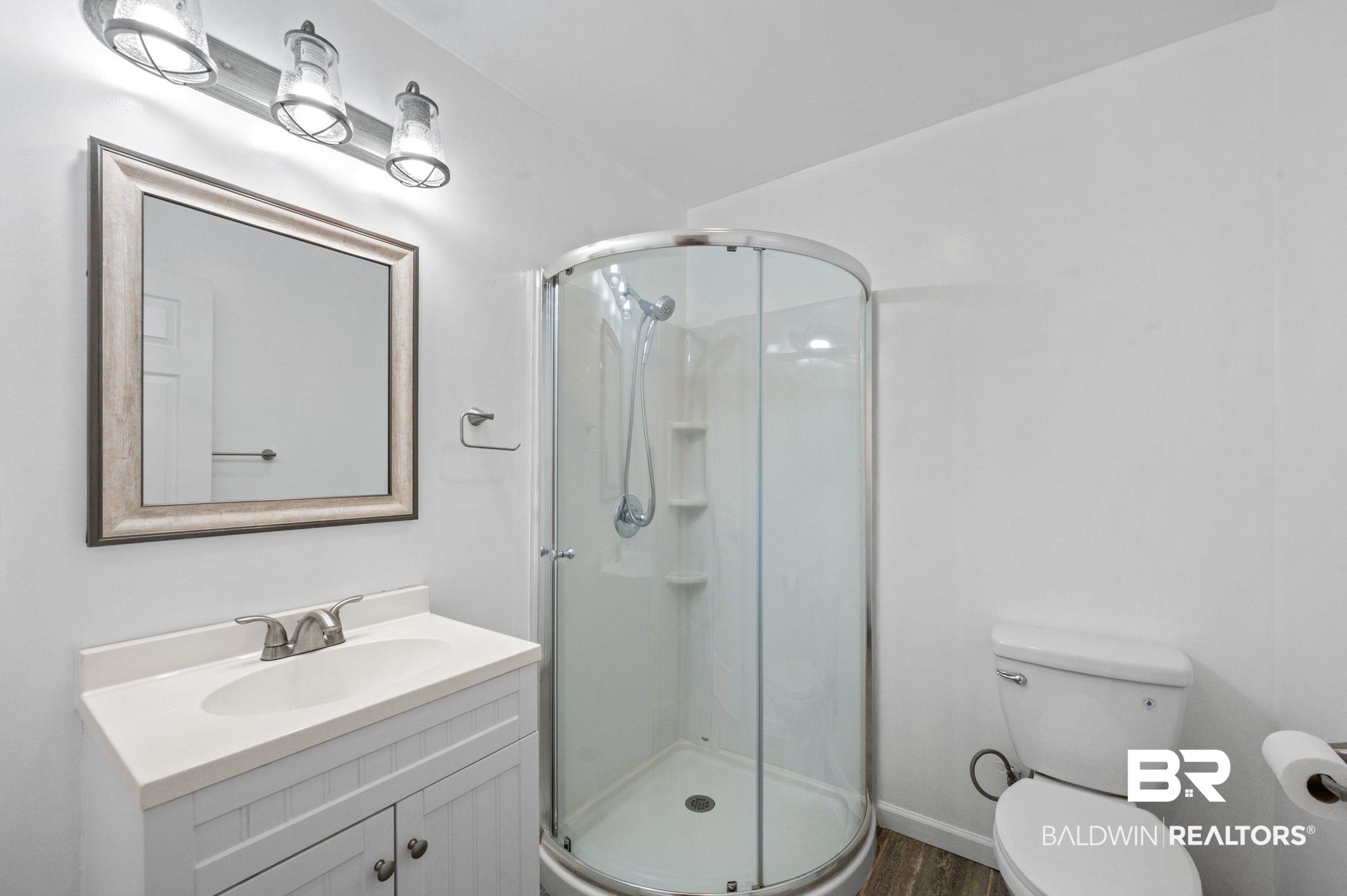 20037 County Road 33 Fairhope, AL 36532 - Photo 60 of 79 Bathroom featuring vanity, wood-type flooring, toilet, and walk in shower