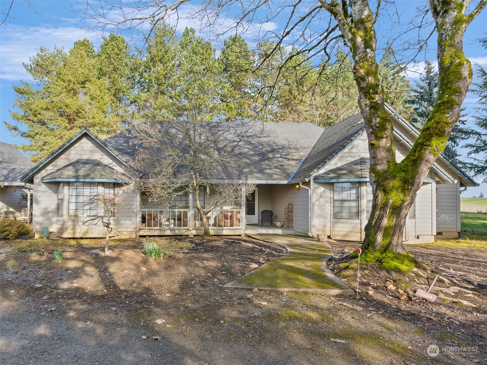 5814 Northwest 169th Street Ridgefield, WA 98642 - Photo 1 of 40 a front view of a house with a tree in it
