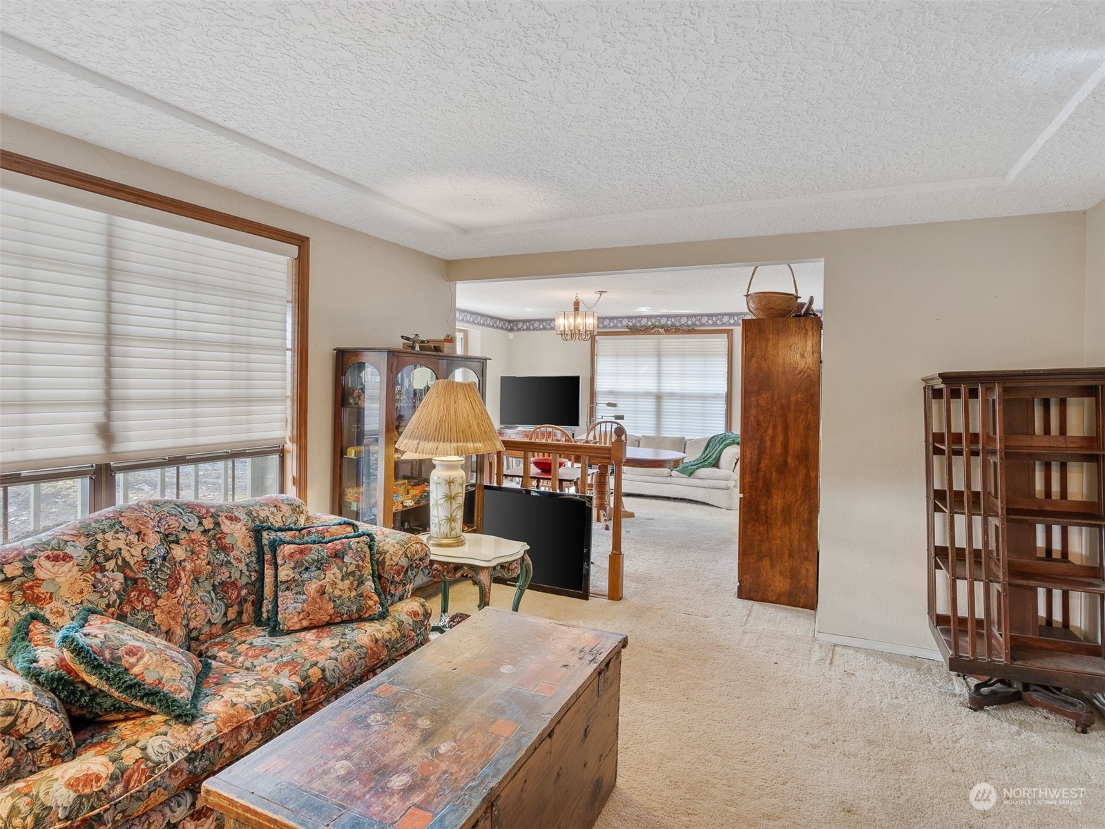 5814 Northwest 169th Street Ridgefield, WA 98642 - Photo 17 of 40 a living room with furniture and a flat screen tv
