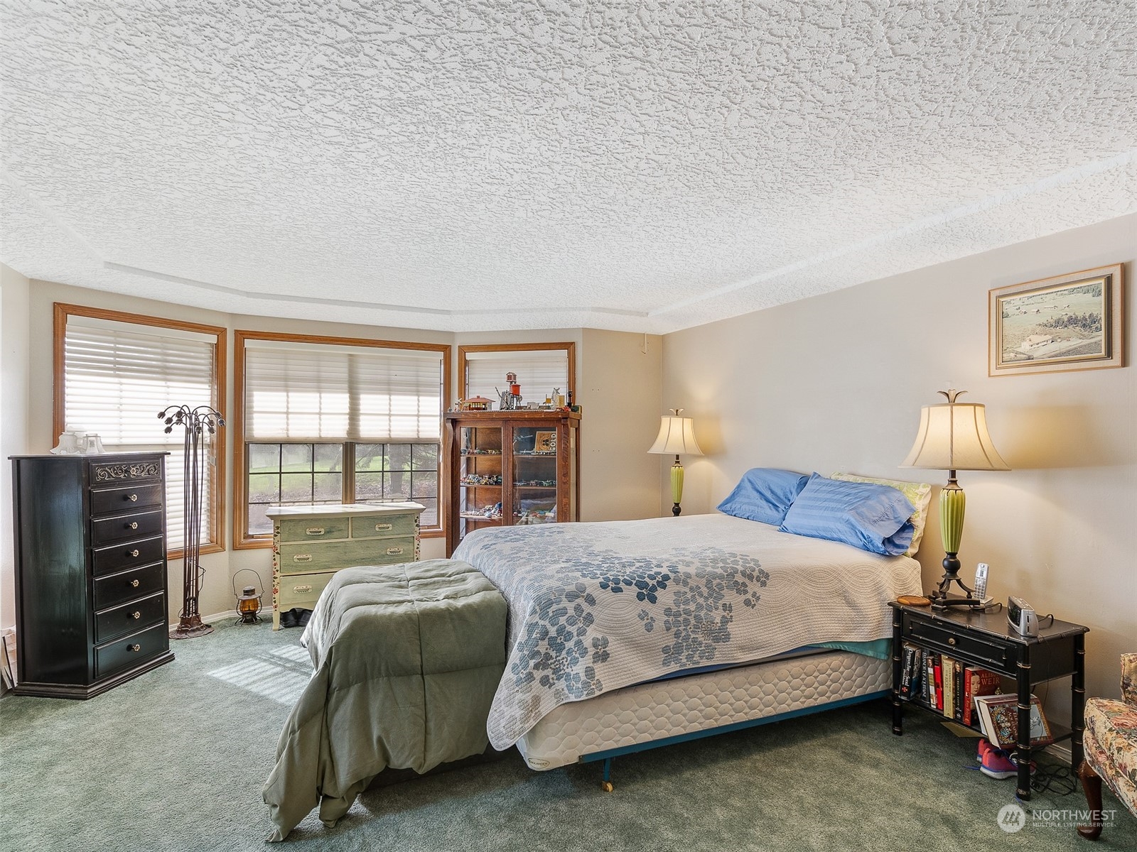 5814 Northwest 169th Street Ridgefield, WA 98642 - Photo 18 of 40 a bedroom with a bed and a walk in closet